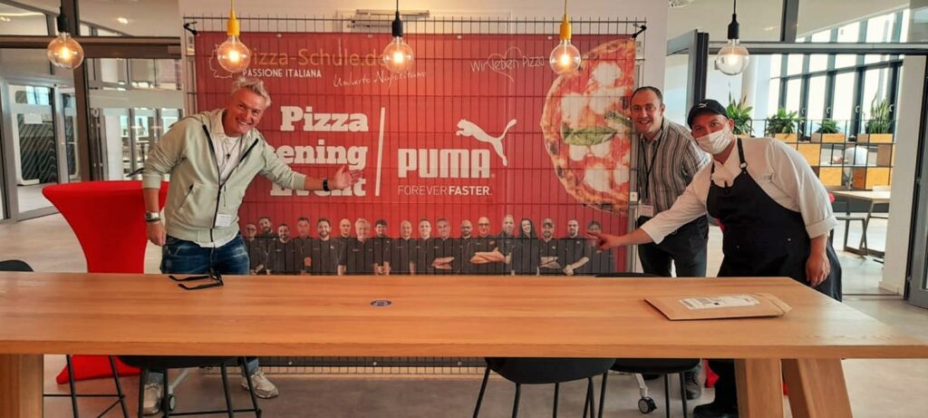 Pizza-Akrobatik zur Musik im Hause PUMA